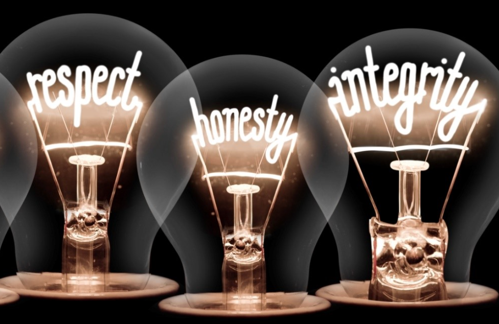 Three ligtbuulbs with respect, integrity, honesty in filaments